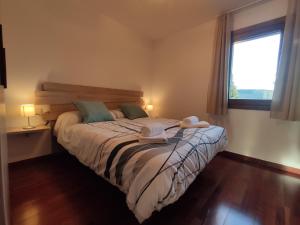 A bed or beds in a room at Allotjaments Paratge Fabas