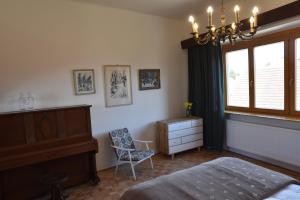 Posteľ alebo postele v izbe v ubytovaní Apartmán s klavírem