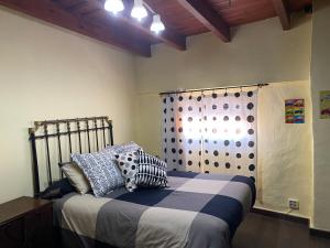 Postel nebo postele na pokoji v ubytování La Casa de Sara