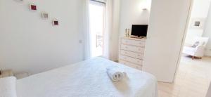 A bed or beds in a room at Apartamento Flamingo by DENIA COSTA