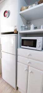 A kitchen or kitchenette at Apartamento Flamingo by DENIA COSTA