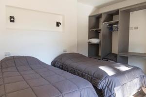 Postel nebo postele na pokoji v ubytování Colina de Ciprés