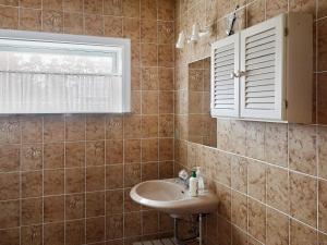 a bathroom with a sink and a window at 6 person holiday home in Højby-By Traum in Højby +33 photos