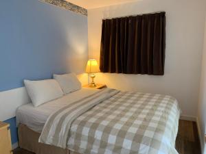 Letto o letti in una camera di Swiss Sunset Inn