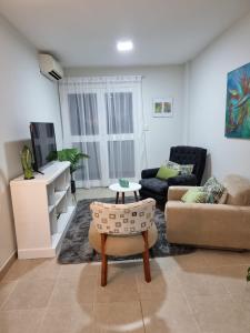 a living room with a couch and a table at Marfil in Posadas