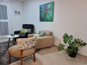 a living room with a couch and a chair at Marfil in Posadas