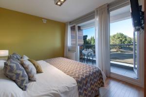 Ένα ή περισσότερα κρεβάτια σε δωμάτιο στο AMANCAY DEL LAGO - Apartamento a Orillas del Lago +39 φωτογραφίες