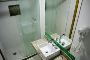 a bathroom with a sink and a shower at Hotel Gomes Freire (Adult Only) in Rio de Janeiro