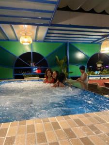 a group of people in a swimming pool at Poetic Hue Hotel & Spa in Hue