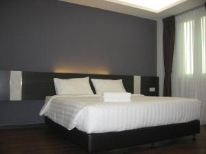 Postel nebo postele na pokoji v ubytování 707 Hotel (Cheng Ho ) Melaka