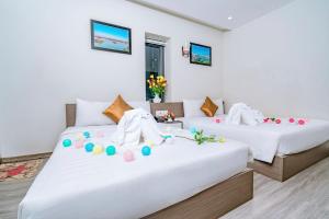 Giường trong phòng chung tại The Shann Hotel Danang