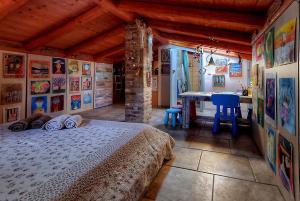 a bedroom with a bed and a table in it at Xenonerantzia Country style villa in Gouvia +42 photos