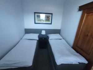 Posteľ alebo postele v izbe v ubytovaní DoMo apartment