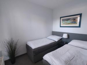 Posteľ alebo postele v izbe v ubytovaní DoMo apartment