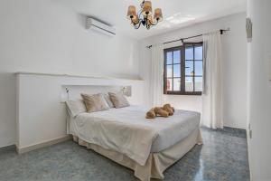 Posteľ alebo postele v izbe v ubytovaní Villa Princesa Faina