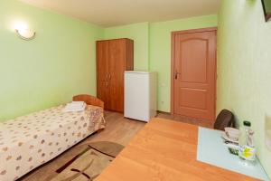 Postel nebo postele na pokoji v ubytování Elektromash Hotel