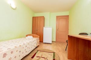 Postel nebo postele na pokoji v ubytování Elektromash Hotel