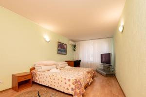 Postel nebo postele na pokoji v ubytování Elektromash Hotel
