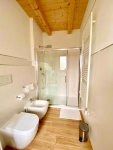 a bathroom with a toilet and a sink and a shower at Locanda Da Marco in Pignone +125 photos