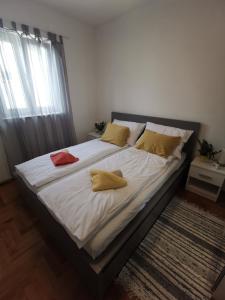 Łóżko lub łóżka w pokoju w obiekcie Apartment Zoanda