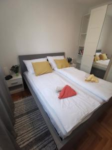 Łóżko lub łóżka w pokoju w obiekcie Apartment Zoanda