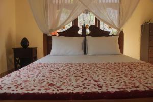 Postelja oz. postelje v sobi nastanitve Pondok Sundari