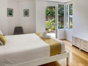Ένα ή περισσότερα κρεβάτια σε δωμάτιο στο Maggies Beachfront Apartment 9 +17 φωτογραφίες