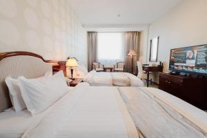 Postel nebo postele na pokoji v ubytování Springs Hotel Ulaanbaatar