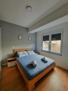 מיטה או מיטות בחדר ב-N&A Apartment