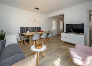 a living room with a couch and a table at House Goga in Ledenice
