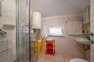 a bathroom with a shower and a sink at House Goga in Ledenice +42 photos