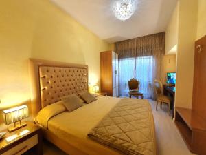 Postel nebo postele na pokoji v ubytování Hotel Continentale