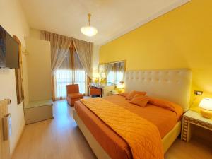 Postel nebo postele na pokoji v ubytování Hotel Continentale