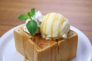 a piece of food on a plate with ice cream on top at HOTEL 555 Air in Higashine