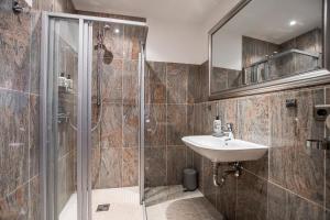 a bathroom with a sink and a shower at Burg Gutenfels in Kaub +47 photos