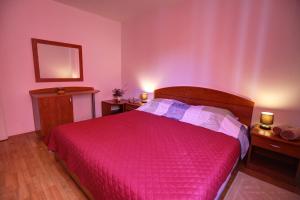 Ein Bett oder Betten in einem Zimmer der Unterkunft Apartment Sally