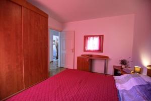 Ein Bett oder Betten in einem Zimmer der Unterkunft Apartment Sally