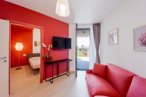 A television and/or entertainment centre at Aregai Marina Exclusive Seaside Apartments