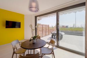 A television and/or entertainment centre at Aregai Marina Exclusive Seaside Apartments