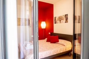 A bed or beds in a room at Aregai Marina Exclusive Seaside Apartments