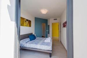 A bed or beds in a room at Aregai Marina Exclusive Seaside Apartments