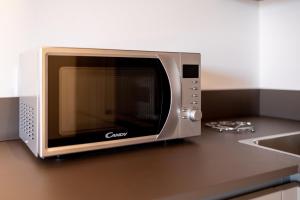 A kitchen or kitchenette at Aregai Marina Exclusive Seaside Apartments