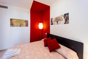 A bed or beds in a room at Aregai Marina Exclusive Seaside Apartments