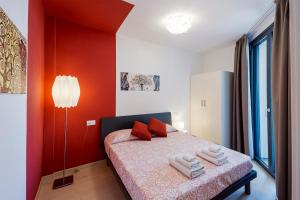 A bed or beds in a room at Aregai Marina Exclusive Seaside Apartments