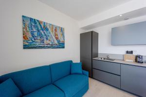 A kitchen or kitchenette at Aregai Marina Exclusive Seaside Apartments