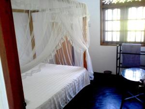 Letto o letti in una camera di Sunstyle Mirissa Guest House