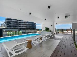 a swimming pool on the roof of a building at Koko luxury apartment in Broadbeach in Gold Coast