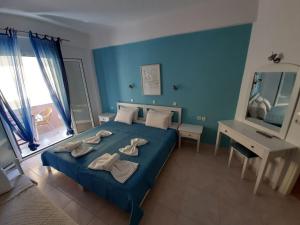 Tempat tidur dalam kamar di Residence La Scala