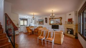 a living room with a table and chairs at Casa Rural Parador del Silo Cónchar by Ruralidays in Granada