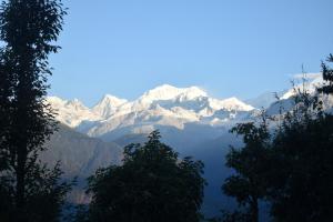 a view of a mountain range with snow covered mountains at Mandavya homestay in Pelling